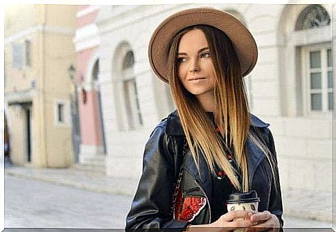 A woman wears a hat to protect against the sun