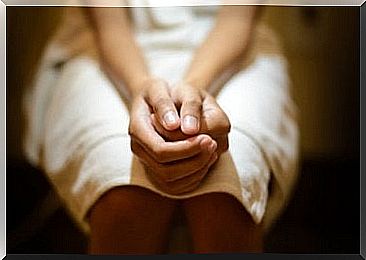 Woman sitting on the toilet because she suffers from fissures