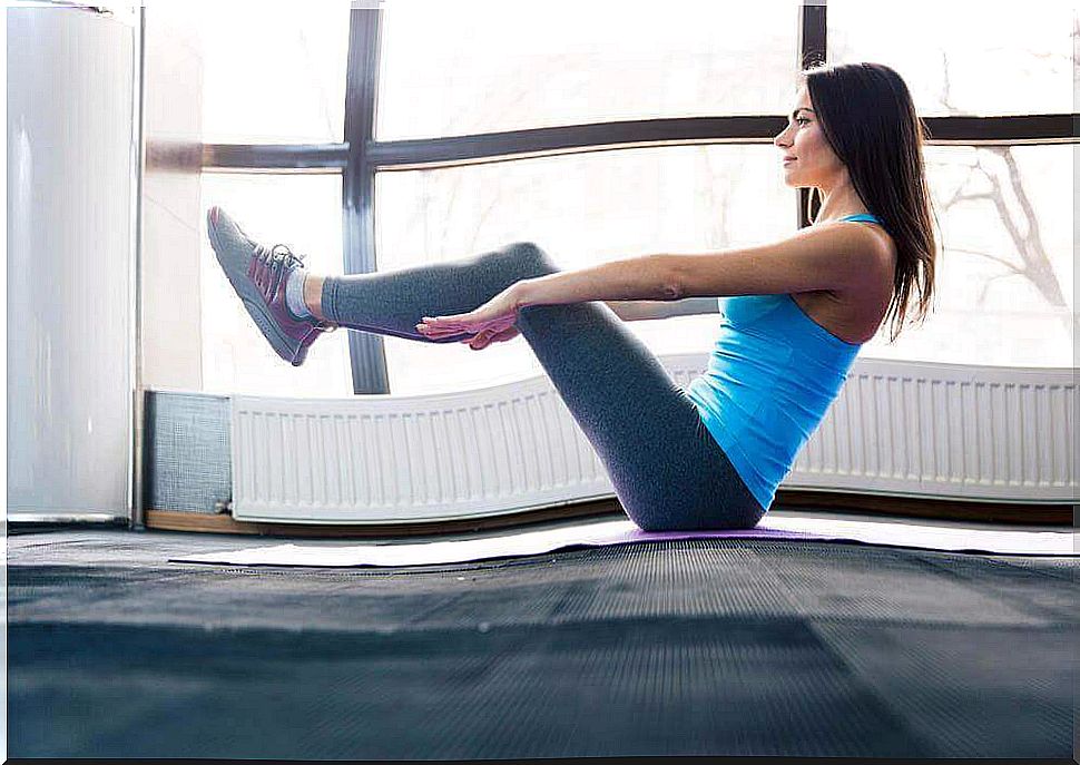 Woman doing v-crunches