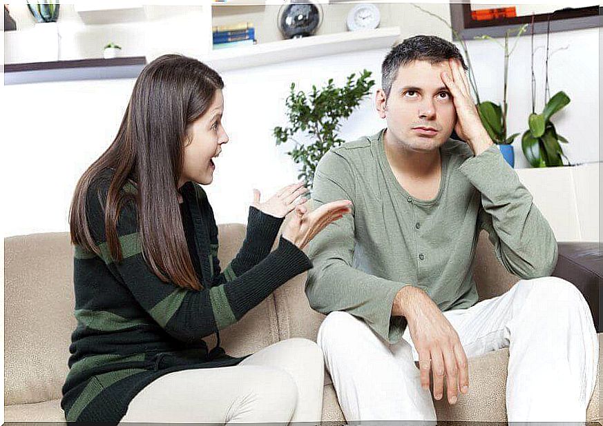 Wife argues and husband looks up tired