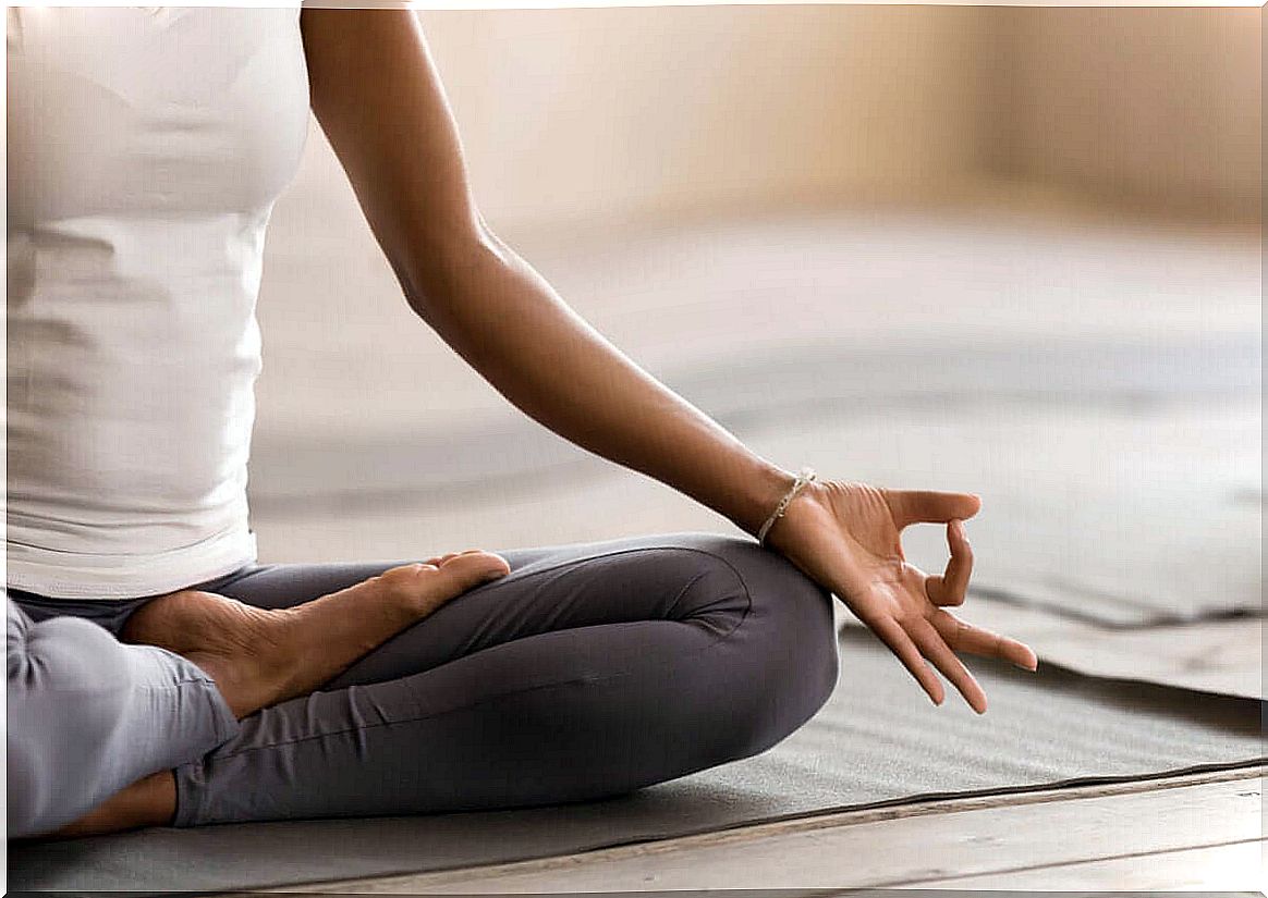 Woman sitting cross-legged