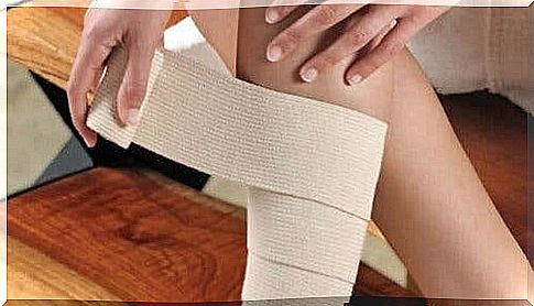 image of a person bandaging his leg