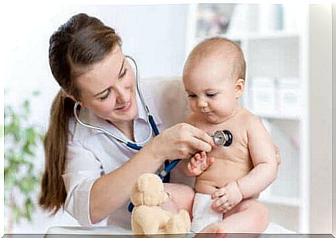 A pediatrician with a baby