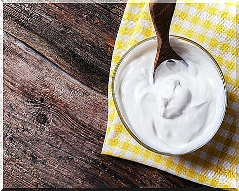 Bowl of yogurt on yellow tablecloth