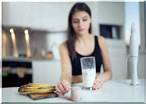 Woman with a banana and a shake