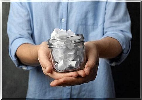 A jar filled with white notes