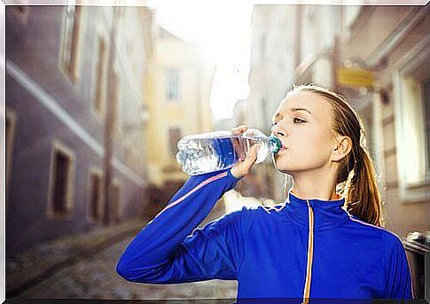 Woman Drinking Water To Get The Perfect Figure