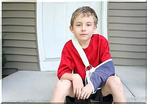 Boy with a broken arm in a sling